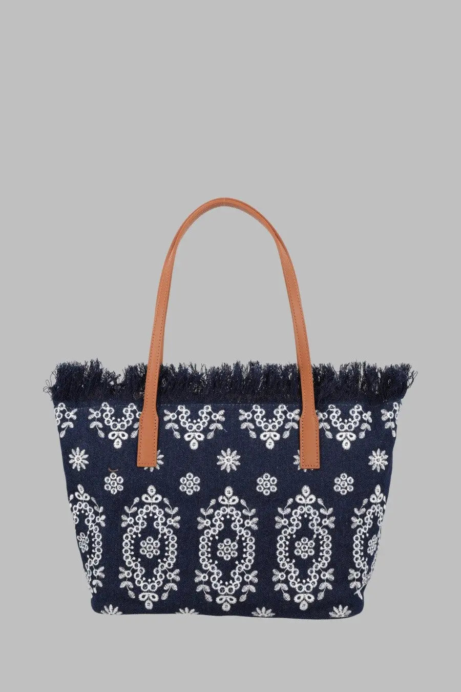 Navy blue woven tote bag with white floral embroidery tan leather handles and fringed top edge by Mc2 Saint Barth