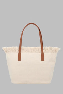 Cream-colored canvas tote bag with brown leather handles and fringed top edge from Mc2 Saint Barth women’s collection