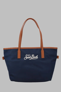 Navy blue canvas tote bag with tan leather handles and white embroidered mc2 saint barth logo in nylon material