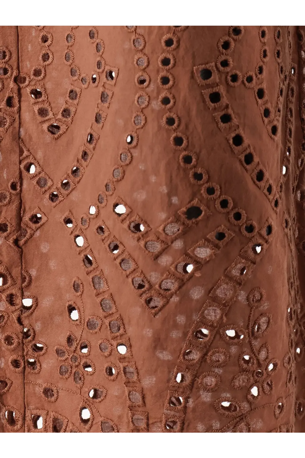 Rust-colored dress with intricate eyelet embroidery featuring geometric and floral patterns by mc2 saint barth