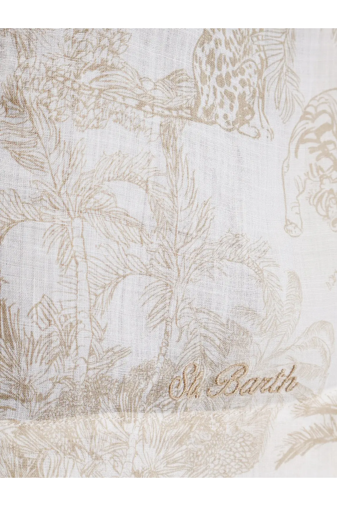 A delicate off-white ramie scarf with subtle beige jungle print and palm trees embroidered with st for women