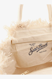 Beige canvas tote bag with frayed edges and gold zipper featuring saint barth summer paradise branding for women