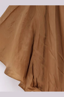 A flowing tan silk skirt with smooth texture and subtle pleats from mes demoiselles cascais long viscose dress beige