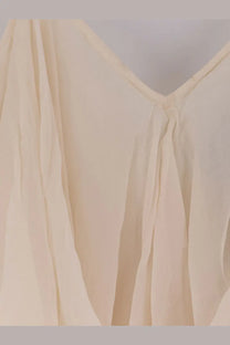 Cream-colored lightweight vestito lungo with soft v-neckline and subtle pleats made of viscosa white by mes demoiselles