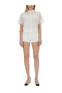 White lace short-sleeved blouse with classic collar and delicate floral pattern from michael kors women’s denim shorts white collection