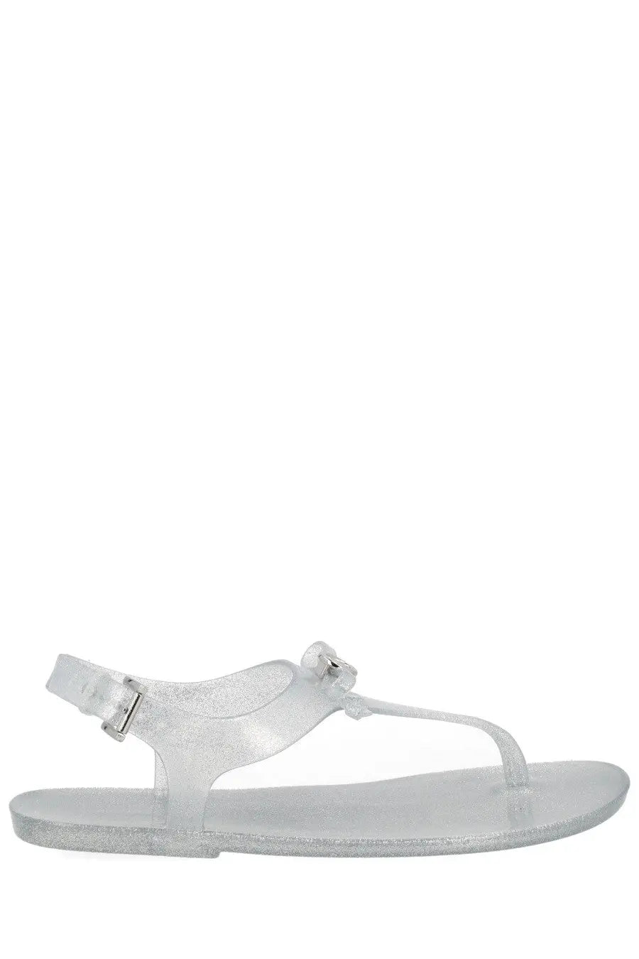 Michael Kors women’s monogram sandal in silver with clear glittery jelly material and t-strap buckle detail