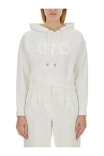 Michael Kors women’s white cropped hoodie with subtle embroidered logo and silver-toned drawstring toggles