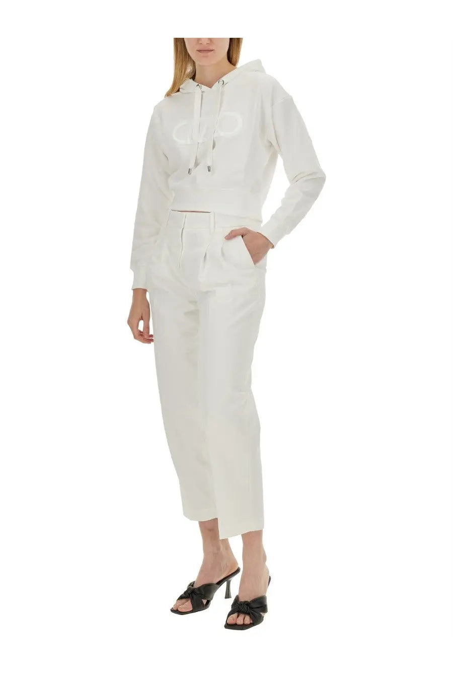 Michael Kors women’s white cropped hoodie with subtle chest logo paired with matching white trousers