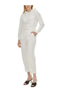 Michael Kors women’s white cropped hoodie with subtle chest logo paired with matching white trousers