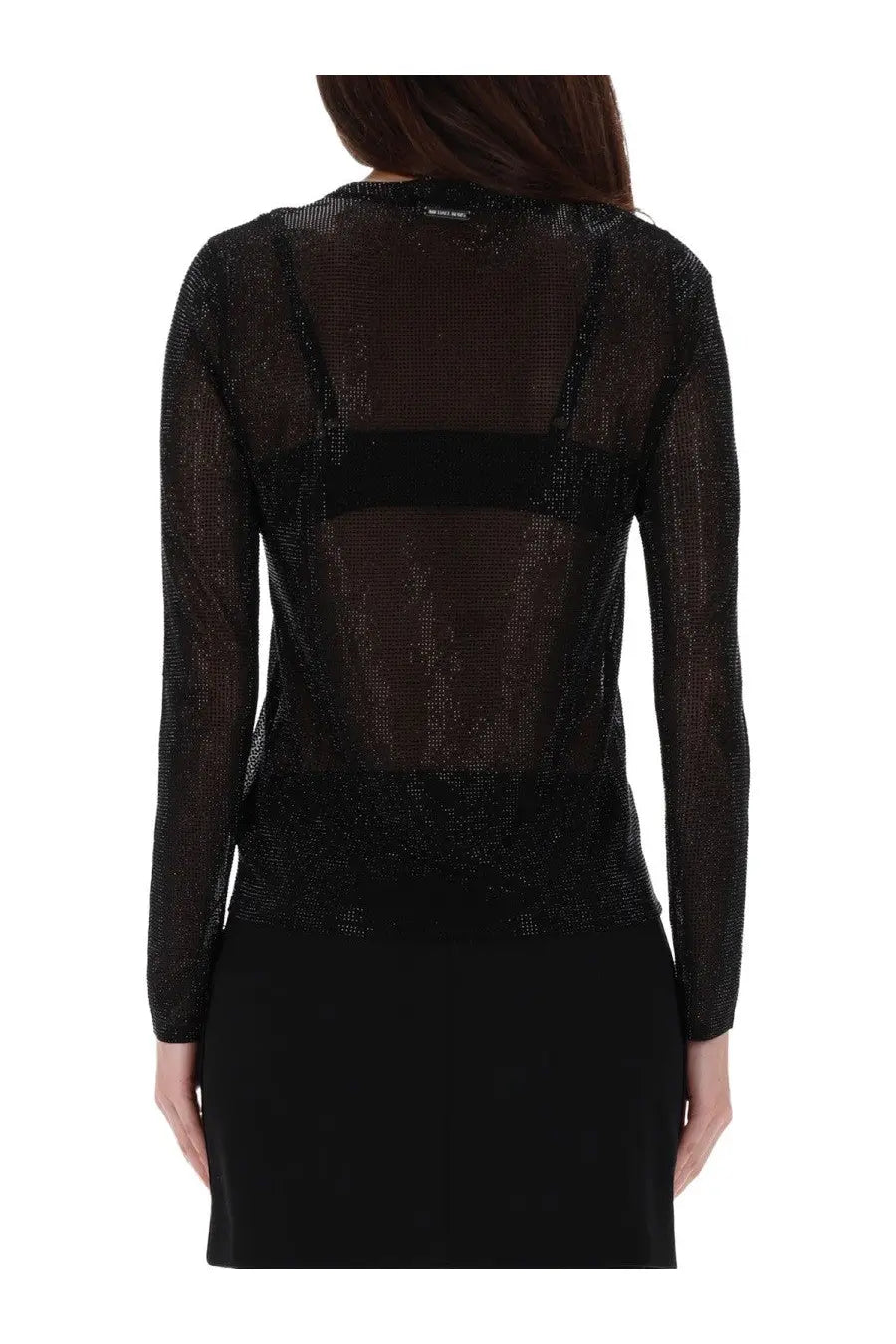 Black sheer long-sleeved top by Michael Kors with sparkling textured fabric and solid black horizontal band on back