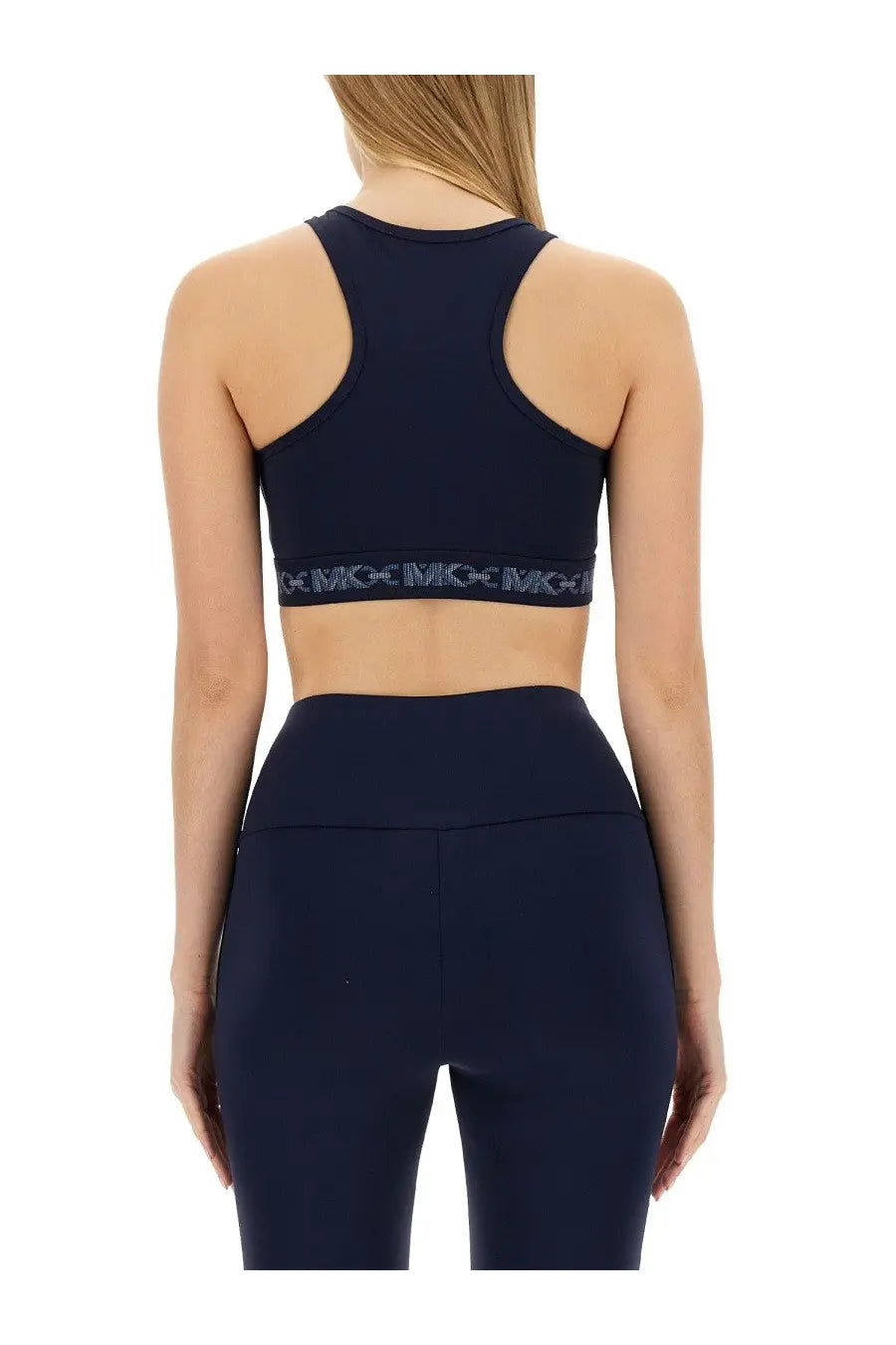 Navy blue michael kors women’s sports bra with black elastic band featuring repeating mcc logo text