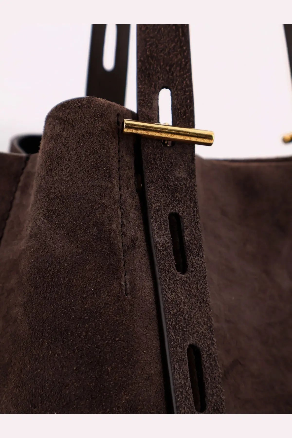 Minobossi women’s Paula suede shoulder bag in brown with a gold-tone metal bar closure and bucket style design
