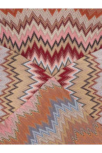 A knitted scarf with a bold zigzag pattern in pink red beige and gray paired with missoni women’s long viscose dress brown