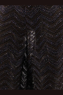 Black sequined mesh fabric with a shimmering textured pattern shown with missoni womens viscose blend brown trousers