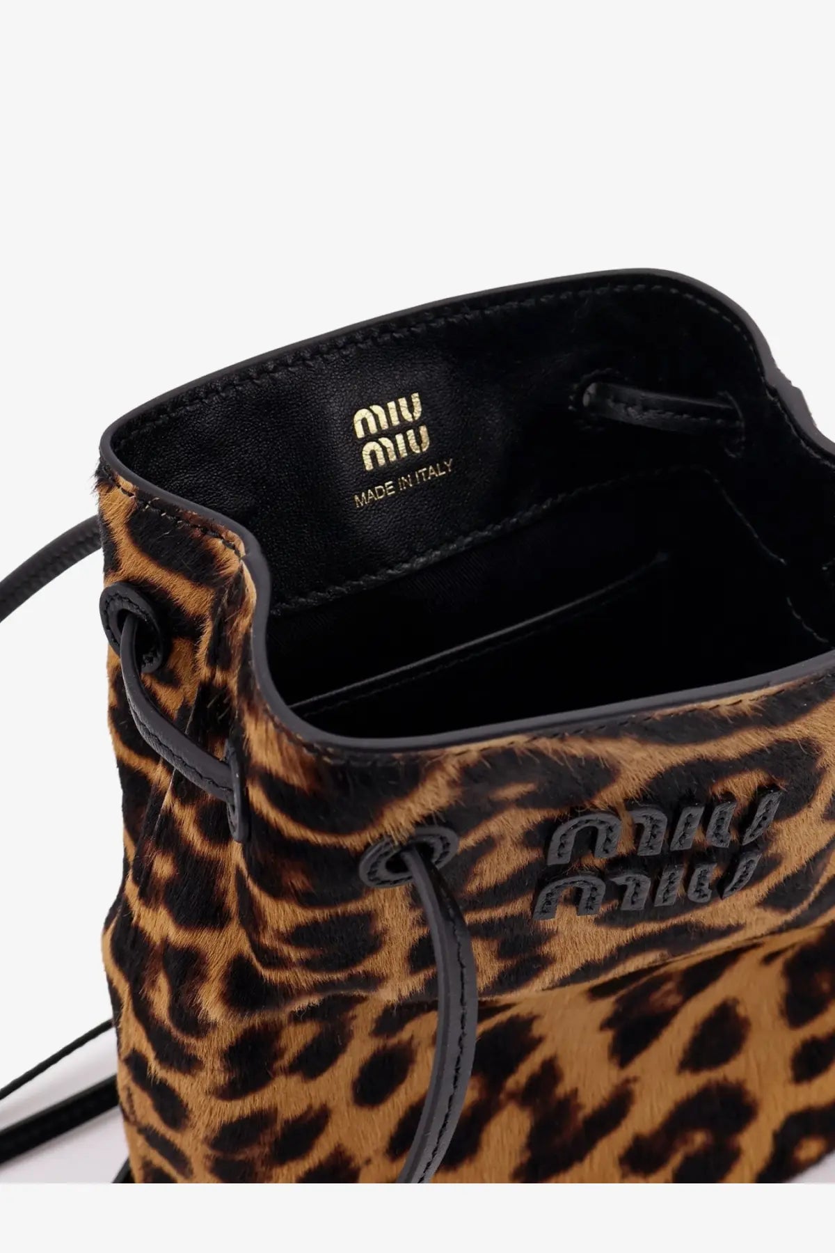 Miu Miu women’s brown leather crossbody bag with leopard print, black leather trim, and drawstring bucket closure