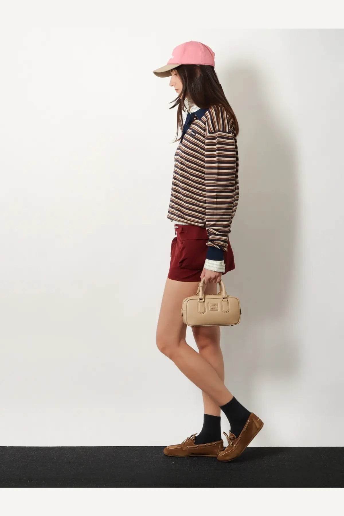 Beige leather mini handbag with top handle and front flap closure from miu miu womens arcadie leather crossbody bag collection