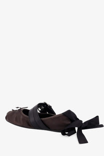 Brown satin miu miu women’s leather ballet flat with black ribbon straps and bow at the heel showing back side