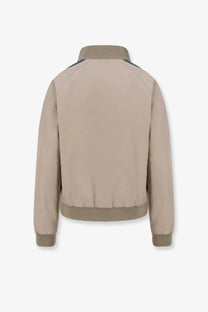 Beige miu miu women’s old twill bomber jacket with dark green shoulder panels and ribbed cuffs