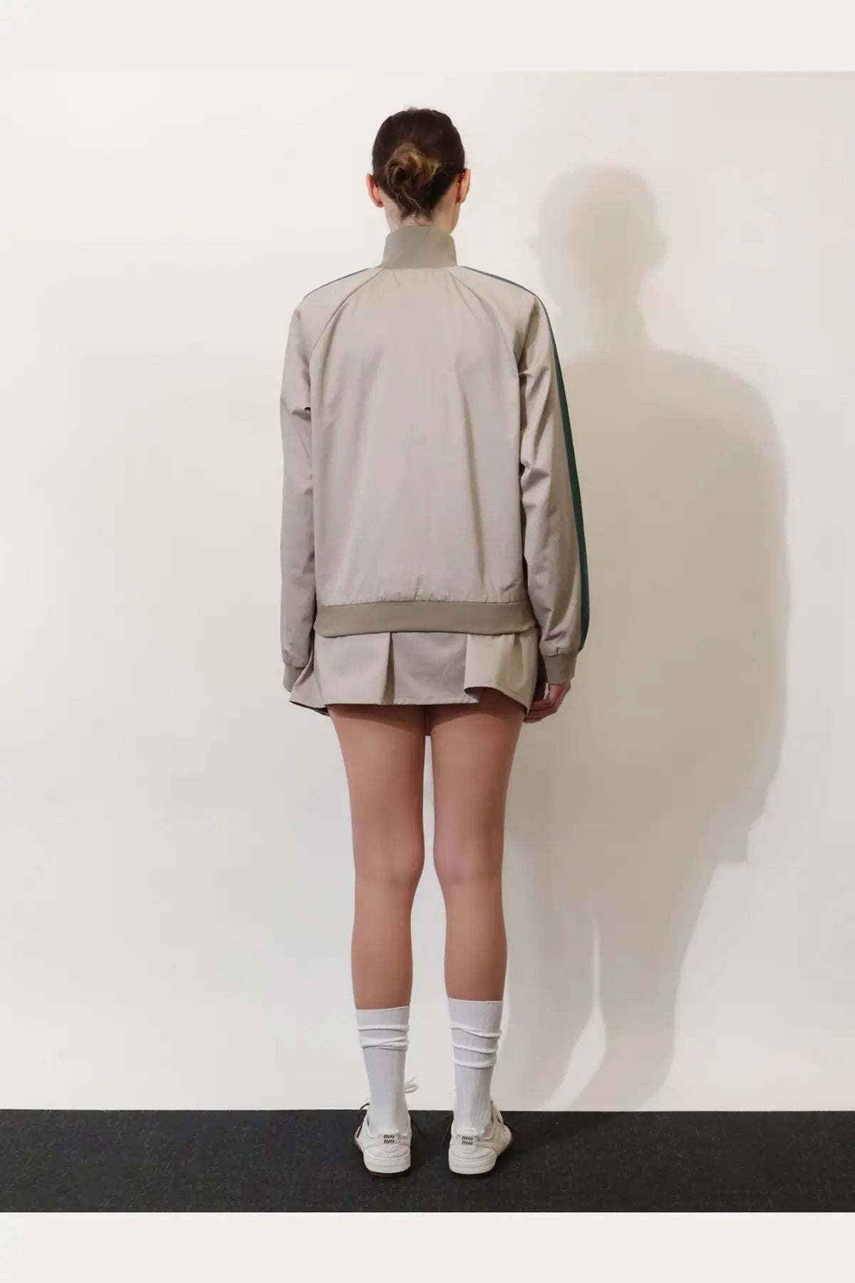 Miu Miu women’s old twill beige bomber jacket with green side stripes and matching pleated hem