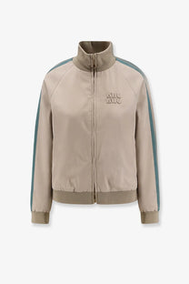 Miu Miu women’s beige old twill track jacket with teal side stripes and matching logo patch on chest