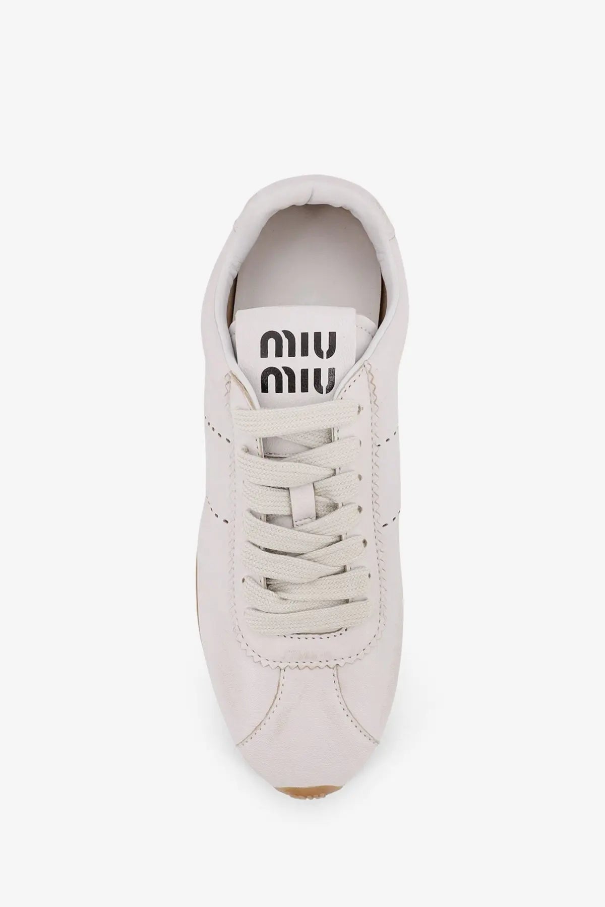 Miu Miu women’s plume leather sneaker in white with matching laces and a minimalist design