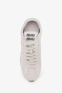 Miu Miu women’s plume leather sneaker in white with matching laces and a minimalist design
