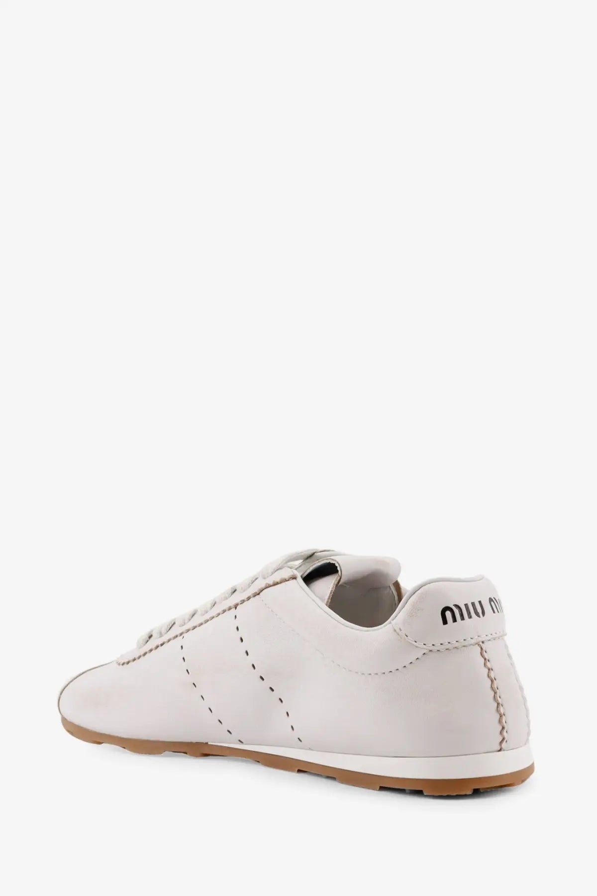Miu Miu women’s plume leather sneakers in white with tan rubber sole and black stitching details
