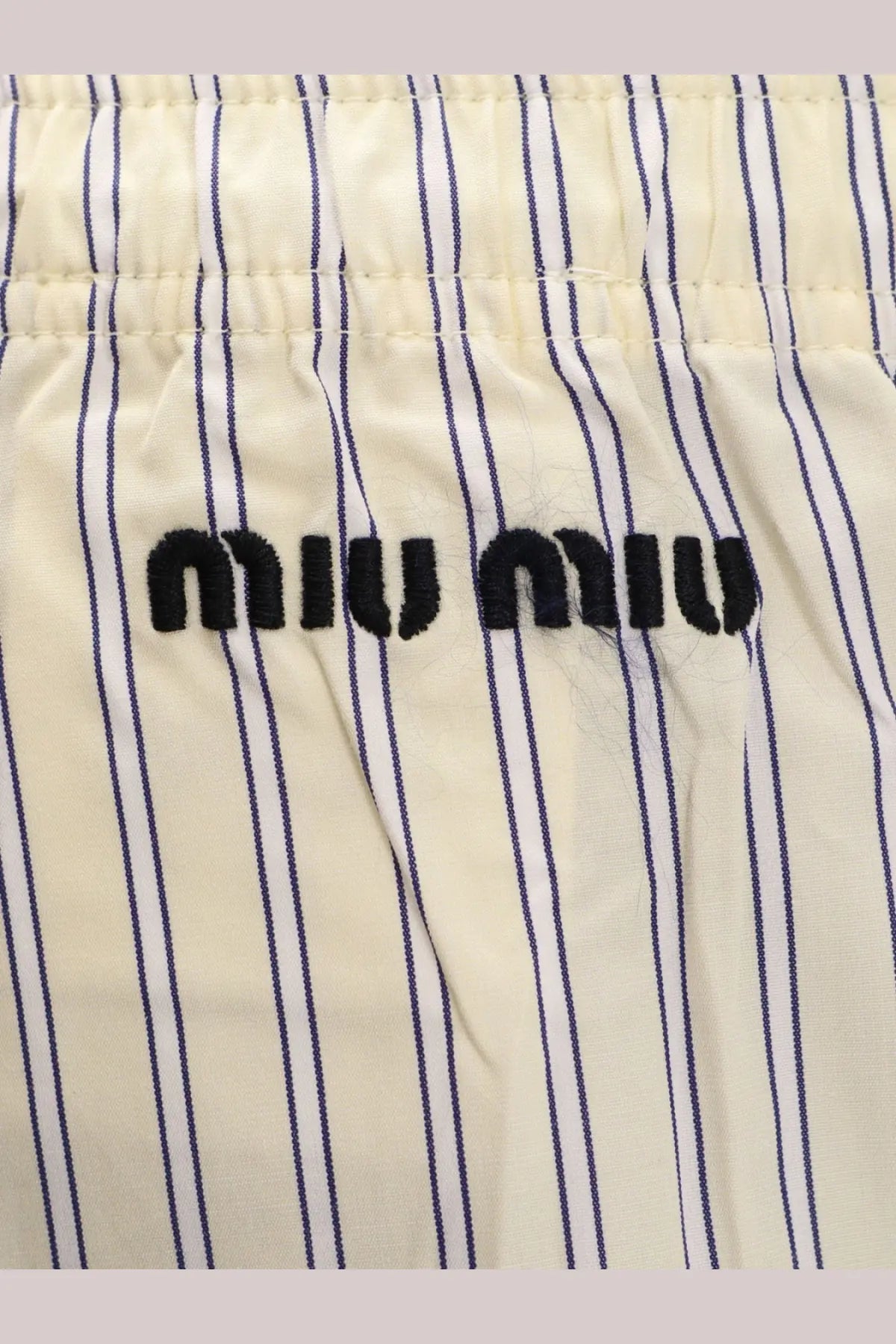 Miu Miu women’s cream cotton pajama shorts with navy blue vertical stripes and a black embroidered logo