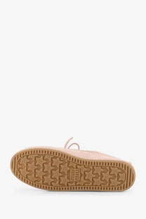 Back view of miu miu women’s pale pink suede moon boot with tan rubber sole and star-shaped tread patterns