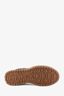Brown rubber sole with star-shaped tread and embossed geo logo on miu miu women’s green technical fabric suede sneakers