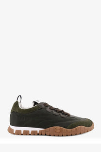 Back view of olive green miu miu women’s suede and leather sneakers with brown rubber sole and textured logo heel