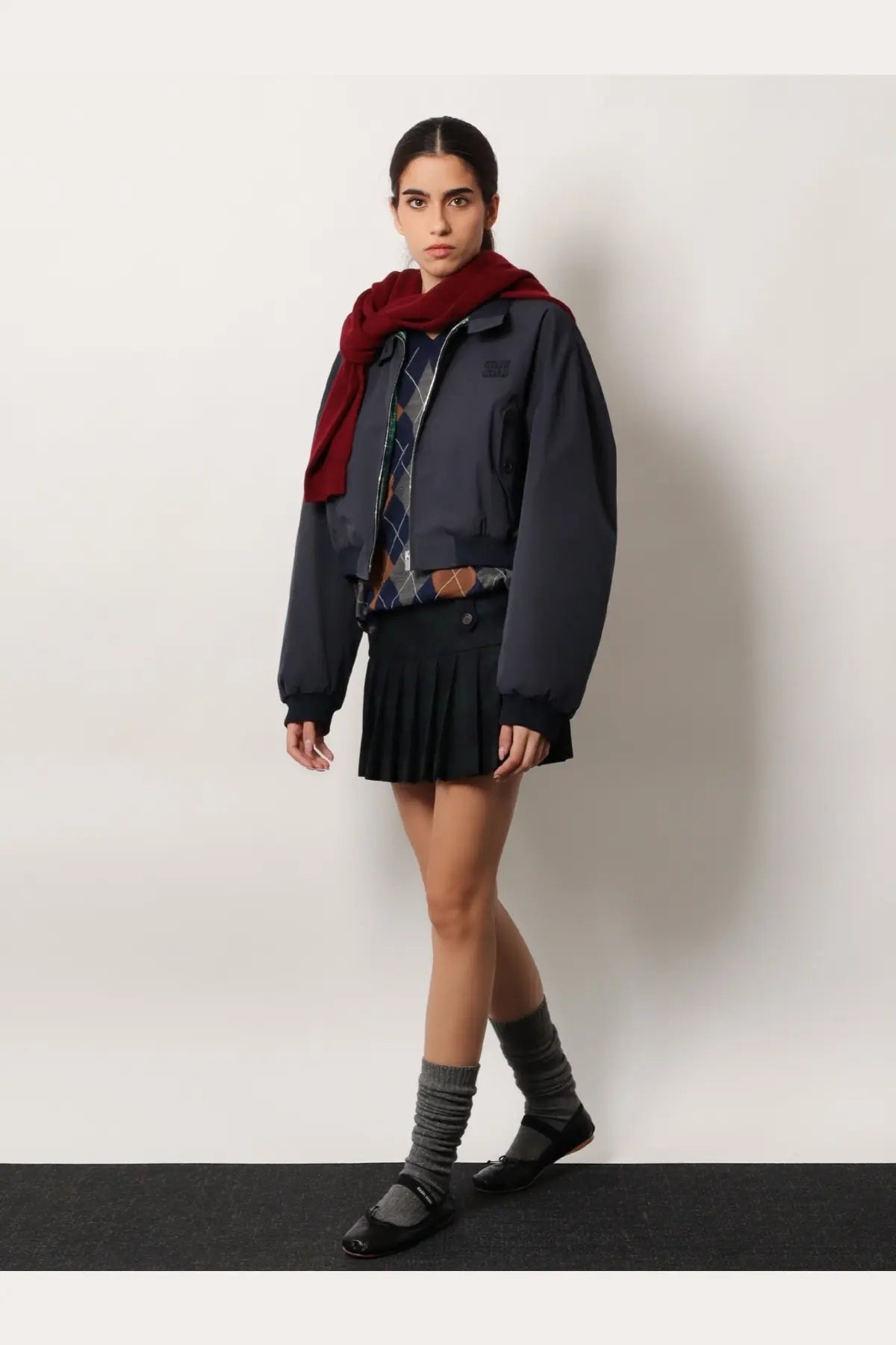 Dark gray bomber jacket with a small black patch on left chest and ribbed cuffs for women by miu miu