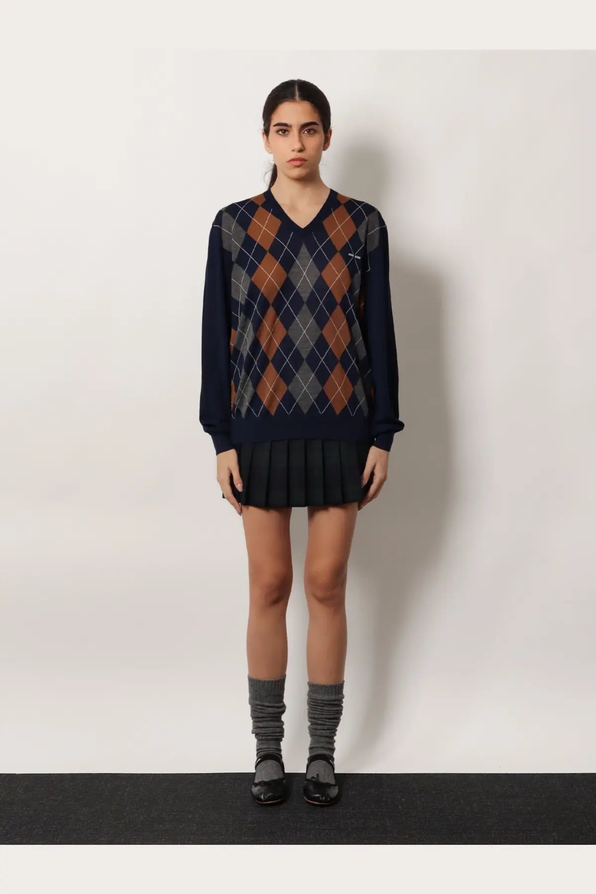 Miu Miu women’s virgin wool sweater in navy blue and brown argyle pattern with a v-neckline