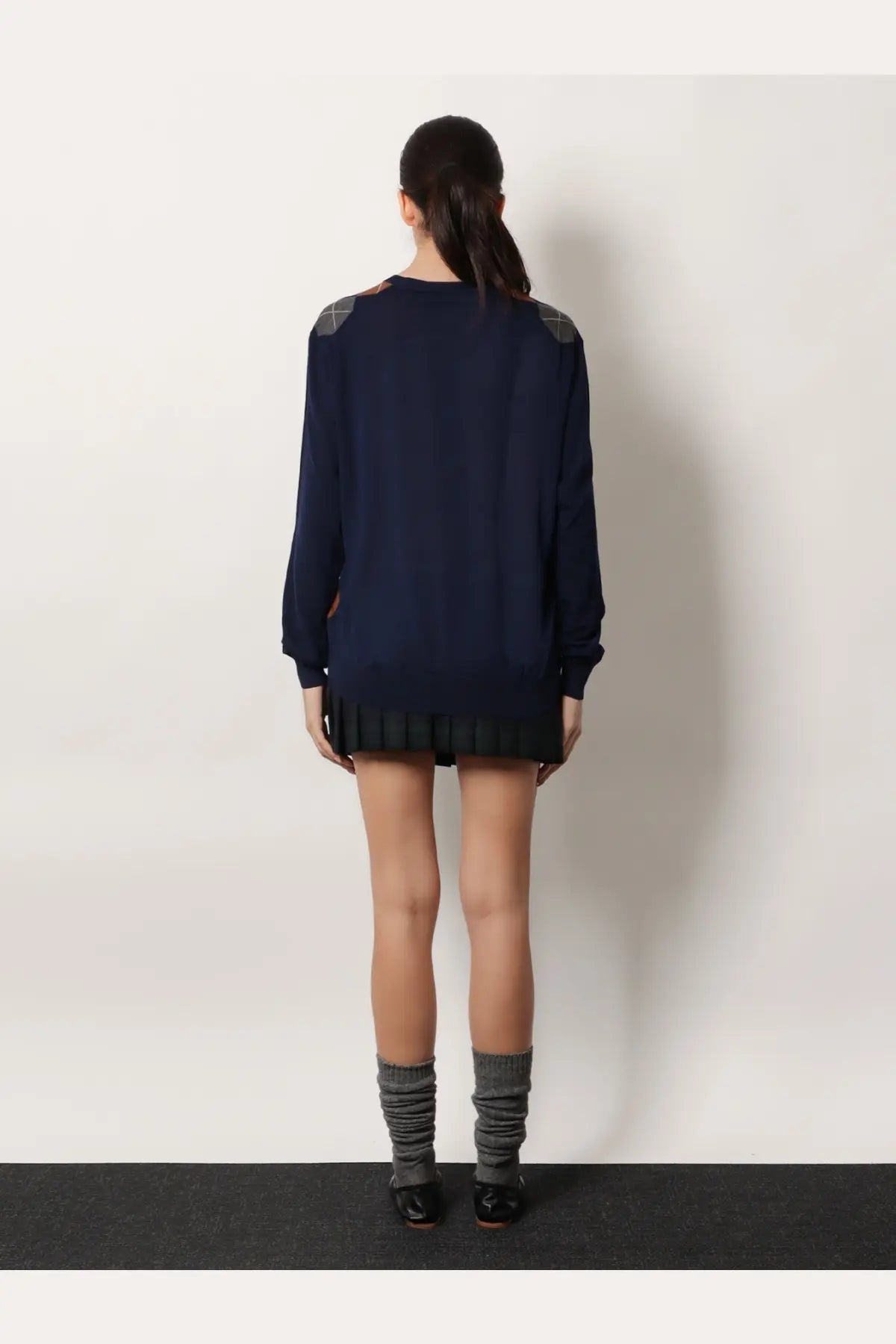 Miu Miu women’s navy blue virgin wool sweater dress with gray argyle shoulders and black pleated hem