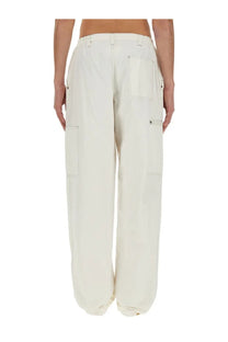 Cream-colored cotton canvas wide-leg cargo pants with multiple pockets and a relaxed tapered silhouette by MM6 Maison Margiela
