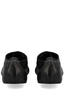Black leather loafers with subtle white stitching in mm6 maison margiela men’s scarpe travel derby black style