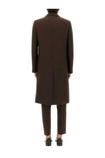 A sleek dark brown wool blend overcoat with classic notched collar and straight-cut silhouette by MM6 Maison Margiela