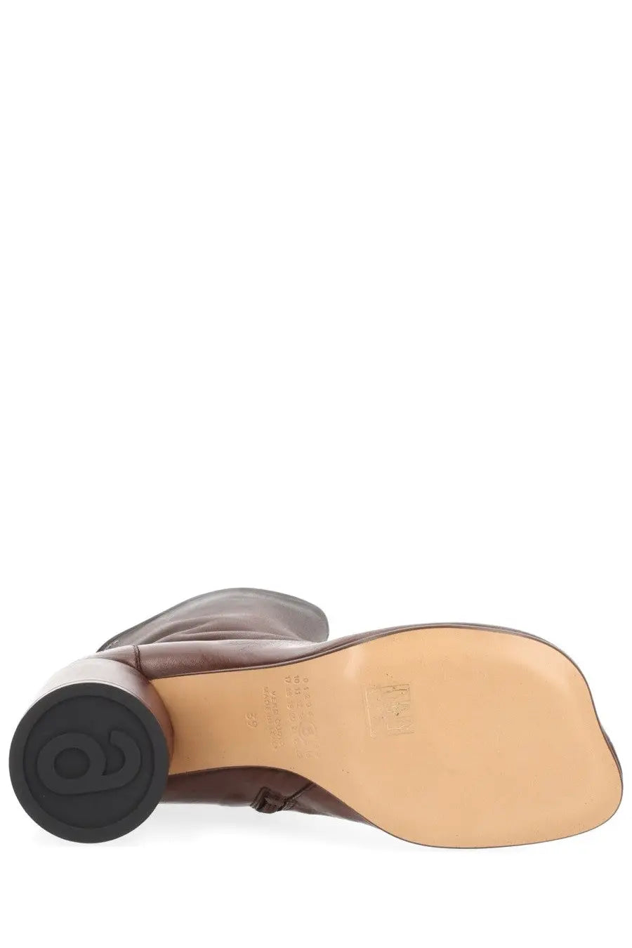 Mm6 maison margiela women’s brown leather boot with black circular heel and tan rubber sole shown from the back