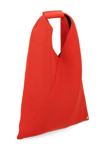 Vibrant red woven canvas tote bag with structured minimalist design and black interior lining by MM6 Maison Margiela