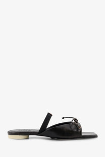Black leather mule sandal with low block heel and decorative bow detail from mm6 maison margiela women’s leather sandals
