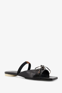 Black leather slide sandal with thin strap and decorative bow detail from mm6 maison margiela womens leather sandals black