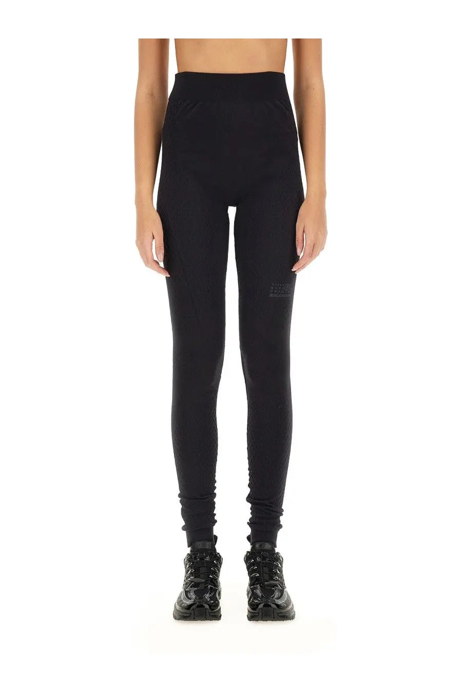 Black high-waisted mm6 maison margiela women’s leggings with sleek form-fitting design and subtle thigh branding