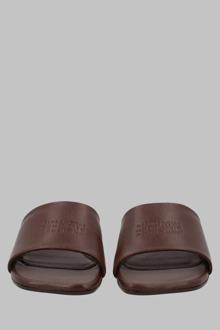 Brown leather slide sandals with minimalist design and embossed logo on strap mm6 maison margiela women’s sandalo anatomic con tacco brown