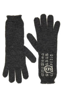 Dark gray wool MM6 Maison Margiela women’s gloves with white numerical and logo pattern on the back of one hand