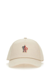 Beige moncler grenoble women’s baseball hat with colorful red blue and white embroidered logo on the front