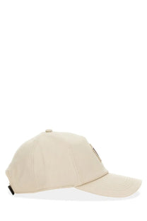 Beige Moncler Grenoble women’s baseball hat with embroidered patch and black adjustable strap at the back