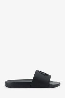 Black rubber Moncler men’s Basile slide sandal with minimalist design and embossed logo on the strap