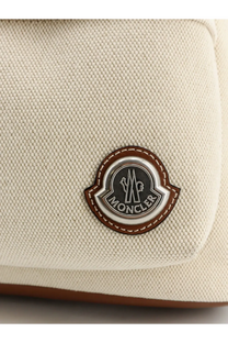 Beige canvas moncler logo patch with brown leather trim and silver emblem on moncler men’s carlo canvas backpack white