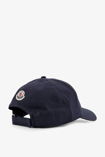 Navy blue Moncler men’s cotton baseball hat with a circular embroidered logo on the side