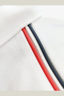Moncler men’s white cotton polo shirt with textured fabric and red white navy striped trim